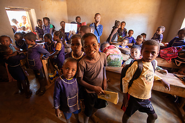 Image showing Happy Malagasy school children students in classroom. School attendance is compulsory, but many children do not go to school.