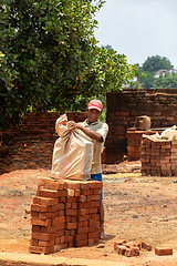 Image showing Street vendor selling handmade building bricks. Mandoto, Madagascar