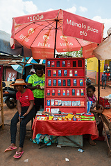 Image showing Malagasy woman sell old fashioned cellular mobile phones on the street of Mandoto.