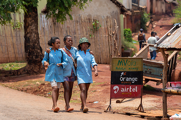 Image showing The three Malagasy schoolgirls in blue uniforms, Mandoto Madagascar