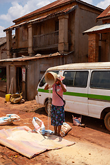 Image showing Street market in Mandoto city, with vendors and ordinary people shopping and socializing. This image portrays the local lifestyle and economy of Madagascar.