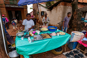 Image showing Street market in Mandoto city, with vendors and ordinary people shopping and socializing. This image portrays the local lifestyle and economy of Madagascar.