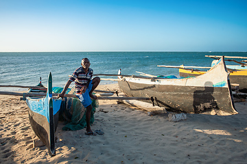 Image showing Fishermen resting on sailboats, traditional outrigger canoe in the coast of Anakao in Madagascar