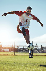 Image showing Man, soccer and ball tricks in sports, fitness and exercise for training, workout or practice on the field in the outdoors. Athletic active soccer player in football sport trick, motivation or cardio