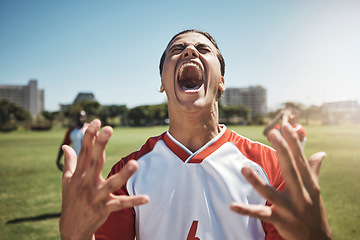 Image showing Happy, winning and soccer playing screaming in joy during a match or training on an outdoor field. Success, fitness and excited man athlete at a football game with achievement or goal on sports pitch