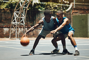 Image showing Basketball, sports and competition with a man athlete and opponent on a court for fitness, exercise or training. Workout, health and sport with male basketball player friends playing a game together