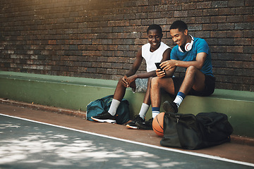 Image showing Smartphone, basketball and black people friends with chat mobile app, 5g social networking or training results update on internet. Relax, sports and athlete men using phone for social media community