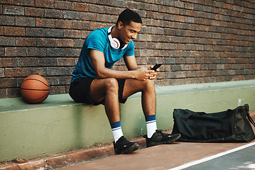 Image showing Man, basketball player or phone for social media app, health data analysis or motivation training schedule. Smile, happy or sports athlete on basketball court on mobile technology in exercise workout