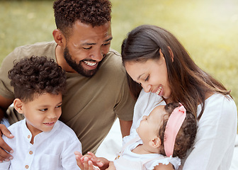 Image showing Happy family, love and baby relax in a garden, laughing and bond while playing on grass in a backyard. family kids and parents enjoying quality time in a park together, talking and embracing children