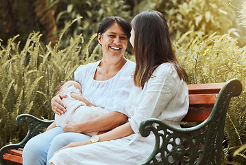 Image showing Family, women and sleeping baby at a park in summer, relax and conversation in nature. Happy family, mother and and elderly woman relaxing on a park bench, laughing and enjoying rest, talking and joy