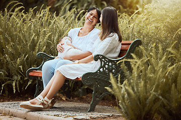 Image showing Women, baby care and outdoor nature park of a mother, child and friend talking together. New mama and a woman spending quality time talking about motherhood in the summer sun by green plants