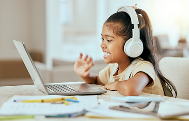 Image showing Video call, online education and child with laptop, headphones and home table for e learning virtual class. Hello, zoom call and girl kid in elearning school listening to audio kindergarten language