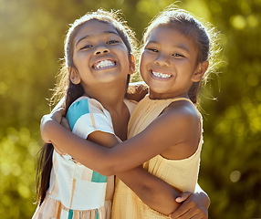 Image showing Happy children, sisters and girl friends hug for love, care and bond in sun park, summer garden and backyard in outdoor Colombia. Big smile, funny and playful portrait of young kids hugging together