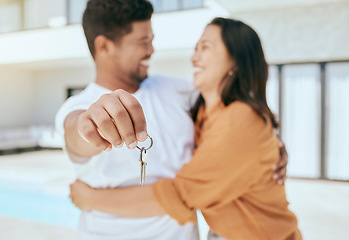 Image showing Couple, hand and key to new real estate, property or house with mortgage loan approval, sales deal success or security investment. Zoom, smile or happy homeowner man and woman in hug and love bond