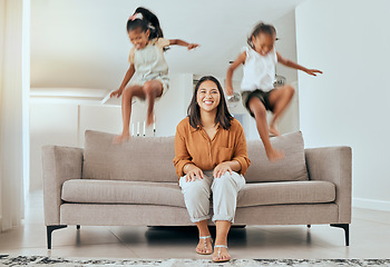 Image showing Family, mom and kids jumping on sofa having fun, energetic and hyper at home. Happiness, joy and portrait of mother sitting with excited children jump on couch, play and relax together on weekend