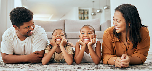 Image showing Love, happy family and lying relax on floor together in living room at home, bonding spend quality time and freedom. Carefree, loving parents laughing and young children smile, laugh and relaxing