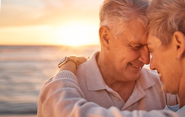 Image showing Love, family and senior couple at a beach at sunset, hug and relax while sharing a romantic moment at the ocean. Travel, sunrise and retirement by man and woman embracing in Mexico, happy and in love