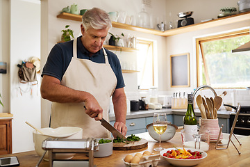 Image showing Cooking, kitchen and senior man with wine for dinner, lunch or home retirement nutritionist chef with chopping board, food and knife. Elderly person with vegetable and alcohol wine glass for luxury