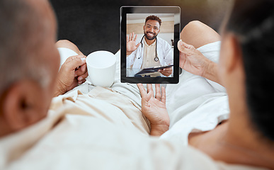 Image showing Digital tablet, video call and doctor consulting with elderly couple in their home for telehealth, checkup and healthcare discussion. Living room, medical and health expert talking to senior people