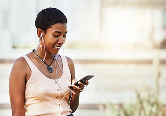 Image showing Black woman, smile and smartphone with earphones, music and communication, social media and audio streaming online. African American person, listening to podcast or radio, connection and technology.