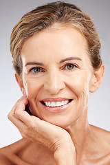 Image showing Skincare, face and portrait of senior woman in studio with beauty, cosmetic and health routine. Happy, smile and elderly lady with wrinkles isolated by gray background with wellness anti aging facial