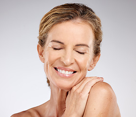 Image showing Beauty, skincare and happy senior woman with a wellness, healthy and organic face routine in a studio. Happiness, wrinkles and elderly lady in retirement with a natural anti aging skin treatment.