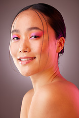 Image showing Futuristic makeup, neon and woman for asian beauty, cosmetics glow and creative product in studio light portrait. Skincare vaporwave and ai model from Korea in headshot smile for dermatology mock up