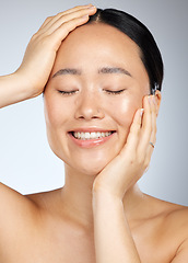 Image showing Skincare, beauty and woman with a smile in a studio with cosmetic, face and dermatology treatment. Happiness, joy and girl model from Japan with healthy, wellness and clean skin with a facial routine