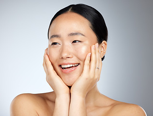 Image showing Skincare, beauty and woman with smile for dermatology against a grey mockup studio background. Face of a happy, relax and Asian model excited about facial care, wellness of skin and cosmetics