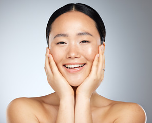 Image showing Cosmetics, asian woman and facial care for natural beauty, wellness and smile being happy, studio background and healthy. Portrait, makeup and organic facial for skincare, health and relax body care.
