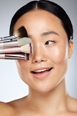 Image showing Makeup, brush and beauty woman for asian skincare glow, cosmetics or product advertising with studio mock up. Dermatology, skin care and artist or Japanese model cover eye for marketing mockup