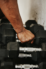 Image showing Hand, dumbbell and fitness with a man bodybuilder in a gym for exercise, training or a workout with weights.