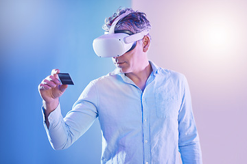 Image showing Credit card, finance and man in with virtual reality metaverse glasses for a digital payment in studio with mockup. Innovation, financial and mature person with a 3d vr headset in a cyber economy