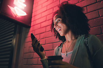 Image showing Black woman, phone and night in city with smile on social media, app or communication on travel, tourist or adventure. Woman, smartphone and metro on web, internet or chat for happiness on smartphone