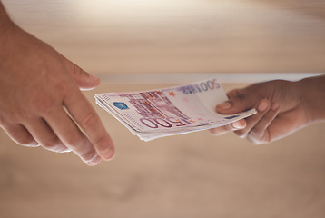 Image showing Bribe, hands and cash money exchange for a business bribery or illegal partnership offer. Closeup of businessmen with a dollar finance deal for money laundering, corruption or loan payment in office.