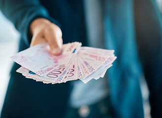 Image showing Cash, bribe and money with euro paper currency in the hand of a business man in an accounting office. Finance, market and investment with a male employee working on the economy or financial growth