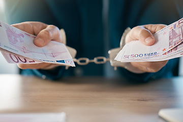 Image showing Handcuffs, justice and hands of businessman with euros arrested for fraud, bribery or money laundering. Law, crime or punishment of male criminal in prison, jail or court for stealing cash or money.