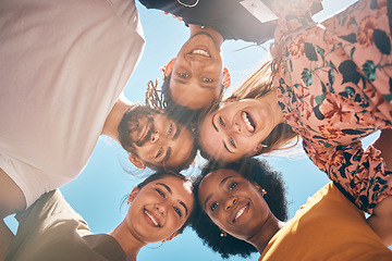 Image showing Friends, diversity and huddle with a man and woman group standing outdoor together on a blue sky in summer. Travel, smile and community with male and female people outside with a smile from below