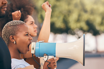 Image showing Protest, megaphone and angry black woman shout for human rights, equality and anti racism at rally. Loudspeaker, revolution and democracy campaign leader on bullhorn for justice and freedom in city