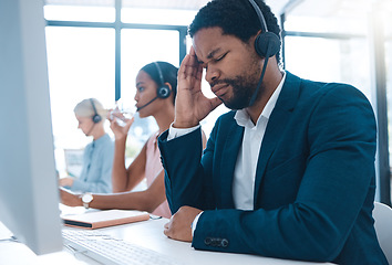 Image showing Stress, headache and call center businessman on computer for customer service or consulting. Support agent, black man and telemarketing virtual advisor tired, frustrated or burnout at crm office