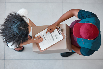 Image showing Delivery, shipping and logistics with a woman customer and man courier signing documents from above. Ecommerce, retail and supply chain with a male shipment worker delivering a package to a consumer