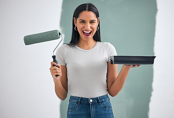 Image showing Home renovation, green paint and woman alone painting an interior wall of room with paint. Home improvement, DIY creative project and paint roller in hand ready for exciting remodeling of house