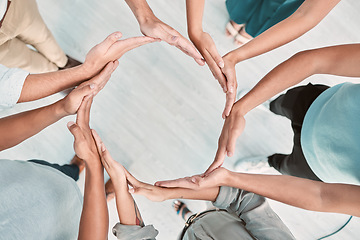 Image showing Team building, support and business people with hands in a circle for partnership, collaboration and teamwork at work. Corporate workers with a mission, community or solidarity for trust from above