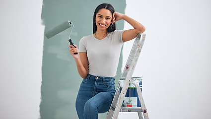 Image showing Paint, wall and woman with color choice in portrait for home renovation, room interior or creative hardware project inspiration. Happy woman painter on ladder for painting with mock up marketing