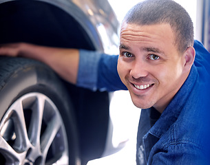 Image showing Mechanic, tire change and happy man car service assistant in automobile shop or road side assistance. Wheel safety, break pad inspection and professional automobile maintenance worker in motor garage