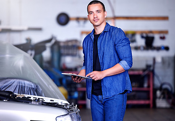Image showing Car, clipboard and portrait of a mechanic at his workshop doing a motor inspection with a checklist. Engineering, industrial and man working on vehicle for engine maintenance, repair or fix in garage