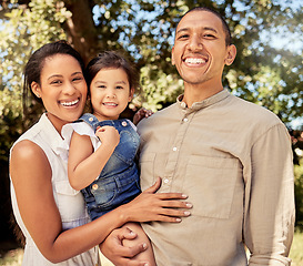 Image showing Portrait, child and parents with smile in a park to relax, peace and calm together during summer. Happy, young and girl with mother and father in a garden in nature during holiday in Indonesia