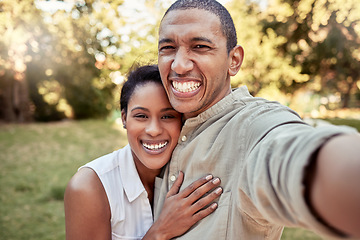 Image showing Selfie, love and garden with a black couple taking a photograph while standing outdoor together in the yard. Portrait, smile and happy with a man and woman posing for a picture on a summer day