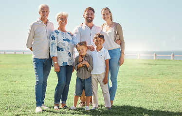 Image showing Smile, field and portrait of happy family on grass lawn for outdoor fun, bonding and quality time together in Toronto Canada. Happiness, vacation and big family of grandparents, parents and children