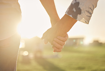 Image showing Retirement, couple and hands with sun closeup of married man and woman on field for summer walk. Support, care and trust of senior people in marriage walking in sunlight for romantic evening.